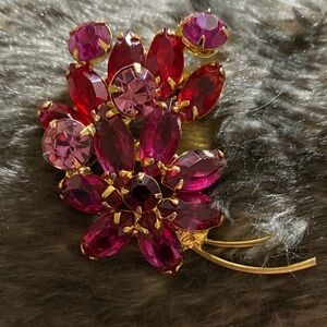 Elegant Gold and Pink Floral Brooch vibrant rhinestones in shades of pink.